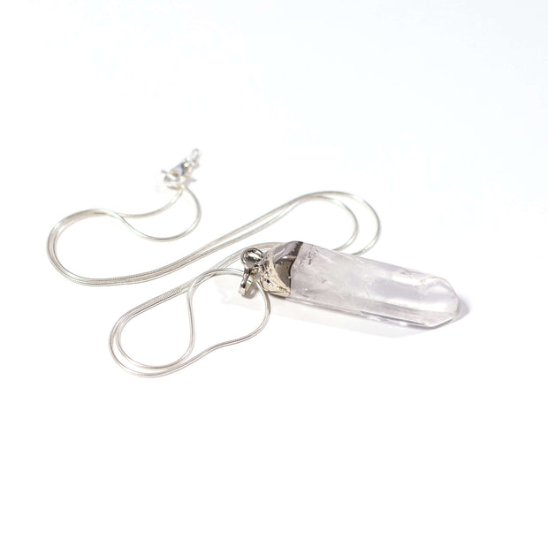 Natural clear quartz point necklace with silver tone stainless steel snake chain.