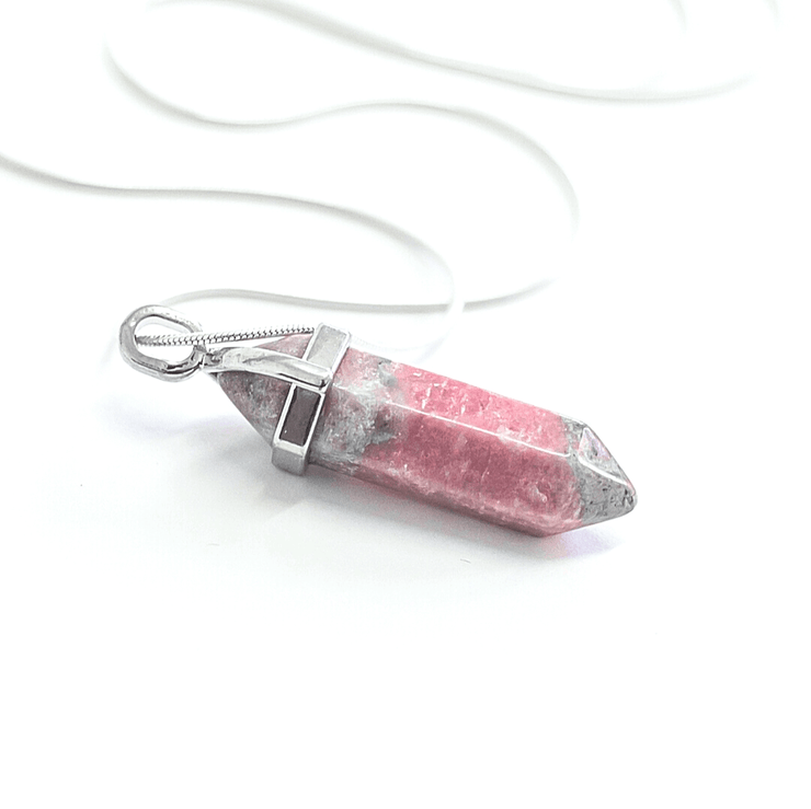 Close up side view of natural Rhodonite crystal complete with stainless steel snake chain.