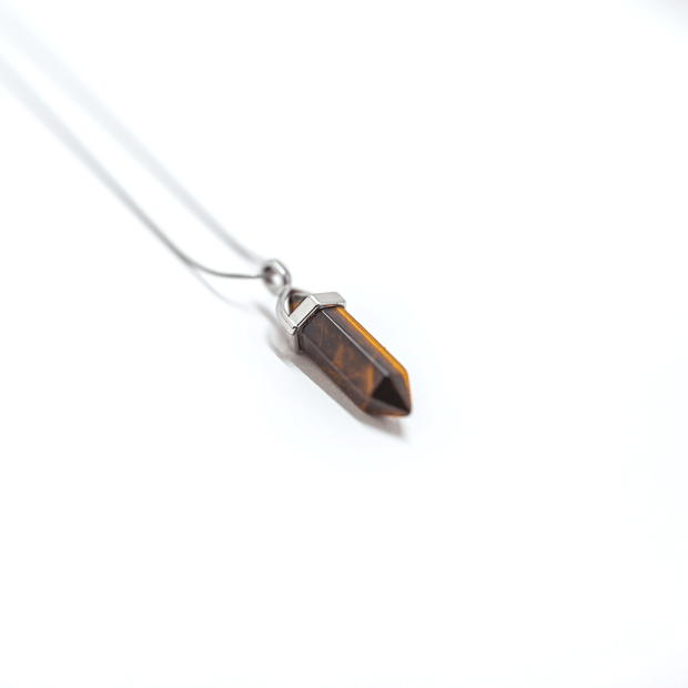 Natural Tiger's Eye crystal. Bullet confidence point.