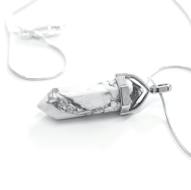 Side view of Calming point Howlite pendant with stainless steel chain chain
