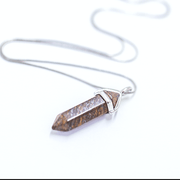 Bronzite necklace, brown in colour with orange flecks bullet point crystal pendant.