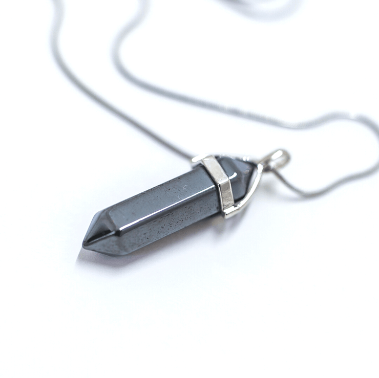 Close up of Silver grey coloured grounding Hematite natural crystal pendant