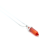 Side view of Carnelian natural crystal orange red colour. Stainless steel snake chain.