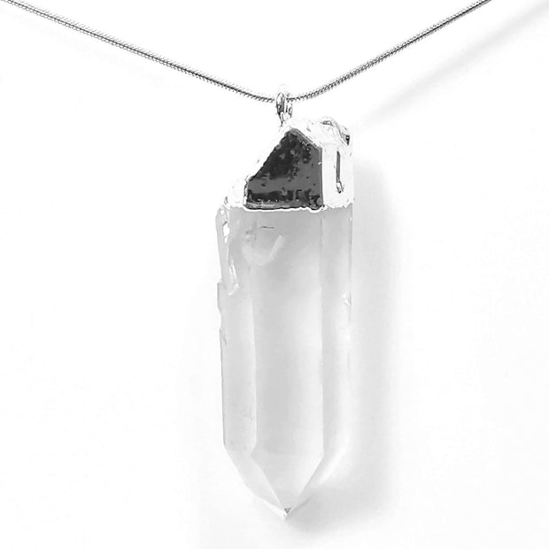 close up head on view of natural healing crystal clear quartz pendant with stainless steel snake chain.