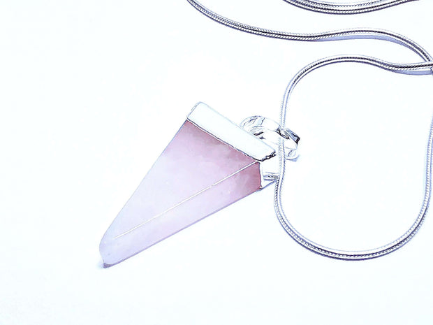 Rose quartz triangle shard pendant with silver tone stainless steel snake chain.