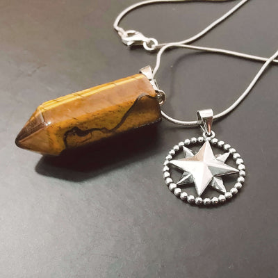 Golden Brown Tiger's Eye bullet point crystal pendant with sterling silver compass star circle charm.