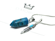 Blue agate and silver feather double necklace. Crown logo visible in background.