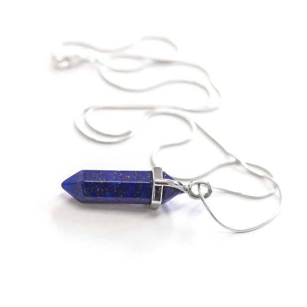 Close up side view of Blue Lapis Lazuli protection and peace pendant along with snake chain