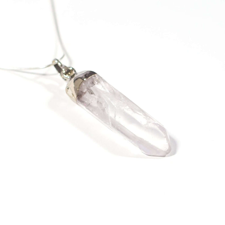 Close up view of large natural healing crystal Clear quartz pendant.