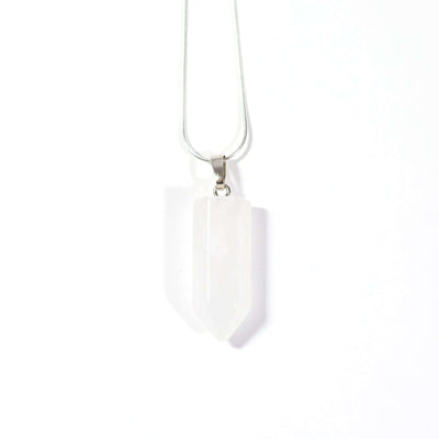 Head on view of Clear Quartz natural crystal bullet point pendant with steel chain.