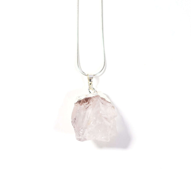 Head on view of rough clear quartz natural healing crystal pendant with silver tone chain.