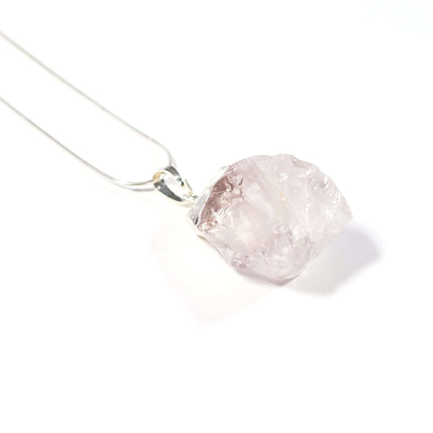 close up view of Clear Quartz Rough cut pendant  with stainless steel snake chain.