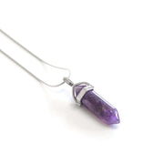 Close up side view of Amethyst natural crystal pendant with stainless steel chain