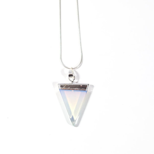 Head on view of opalite triangle necklace with silver tone snake chain.