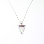 Head on view of opal translucent triangle pendant with snake chain.