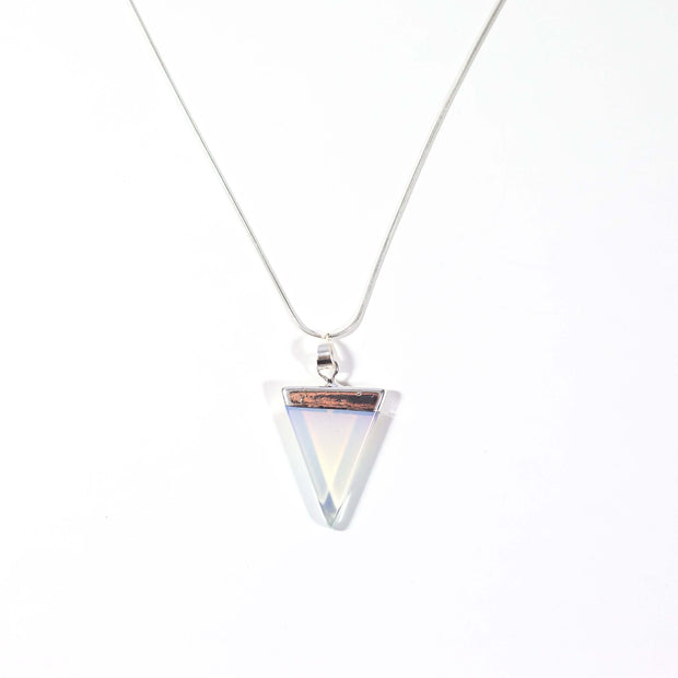 Head on view of opal translucent triangle pendant with snake chain.