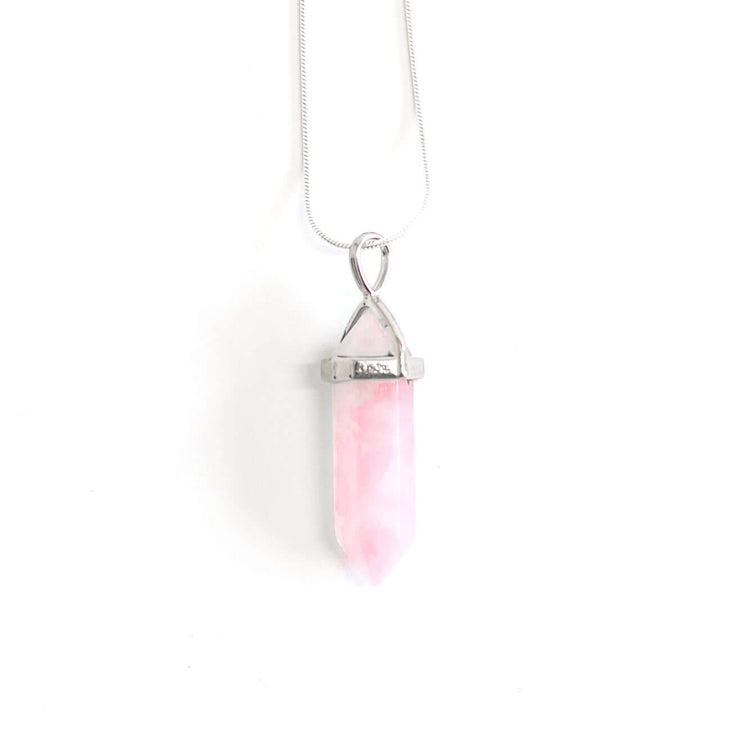 Head on view of Love natural point crystal rose quartz with stainless steel snake chain