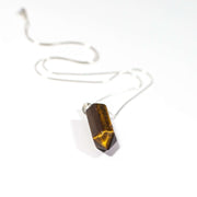 Golden coloured Tiger's Eye bullet pendant necklace with stainless steel snake chain.