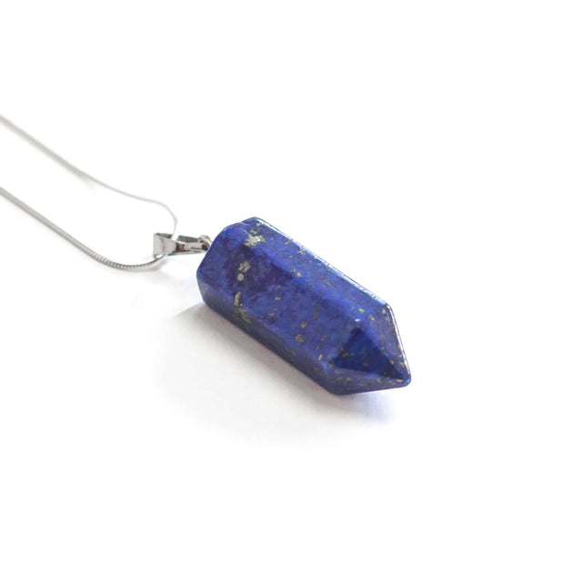 Natural Royal blue lapis lazuli bullet point crystal pendant with silver tone snake chain. 