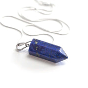 Close up of Blue Lapis Lazuli Bullet point pendant with high quality stainless steel snake chain.