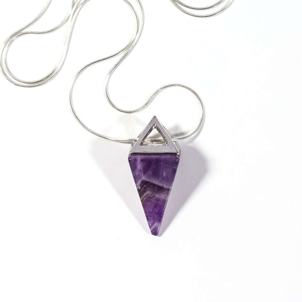 Head on view of purple amethyst crystal pyramid pendant with silver tone stainless steel chain.