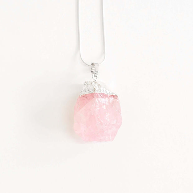 Head on view of pink Rose quartz love and compassion necklace with high quality chain.