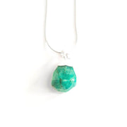 Head on view of  green faceted amazonite pendant with stainless steel snake chain.