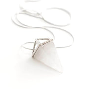 Close up of Clear quartz pyramid necklace with stainless steel snake chain.