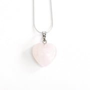Head on view of Rose quartz love heart necklace complete with silver tone stainless steel snake chain.