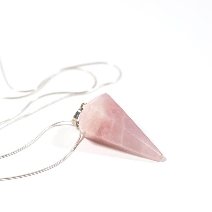 Side view of Natural crystal Rose Quartz Love cone pendant with stainless steel snake chain.